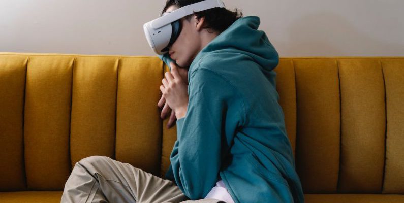 Living Experience - Man in VR headset sleeping on sofa