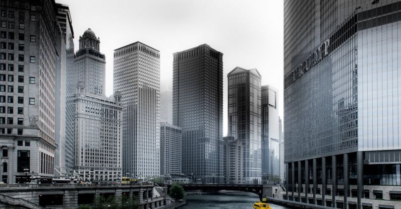 River Cruise - Photo of Boat Going Through River in Between Highrise Buildings