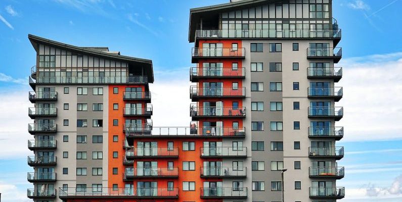 Apartment - Gray, Red, and Orange Concrete Building