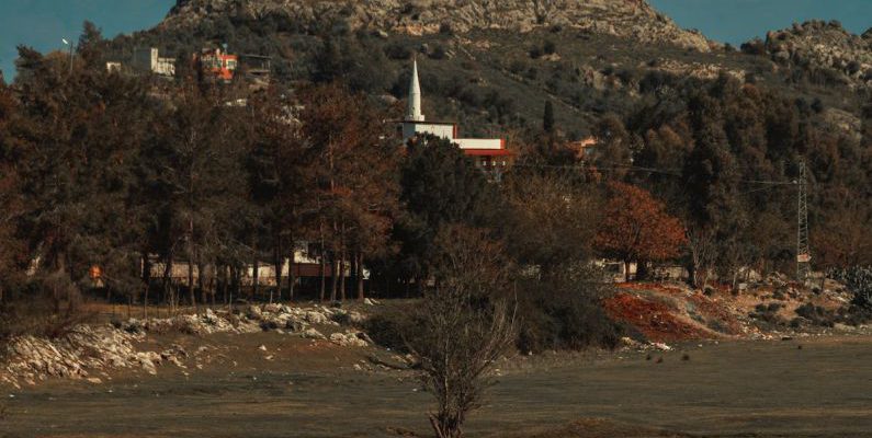Villages - A castle on a hill overlooking a body of water