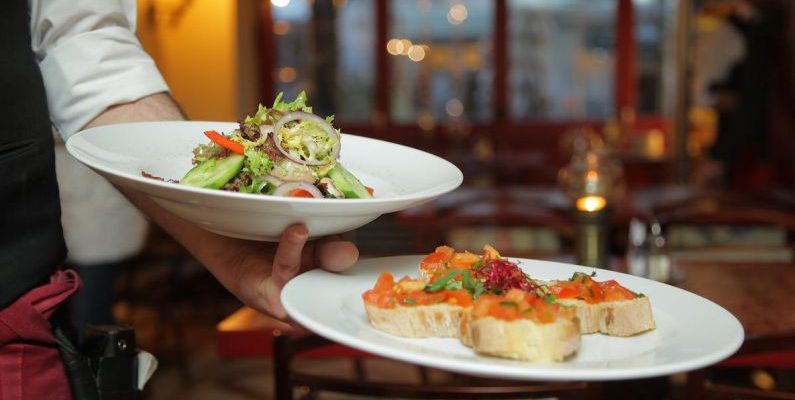 Dining - Person Holding Pastry Dishes on White Ceramic Plates