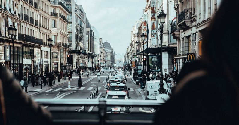 Taxis - Cars on Road Between Buildings