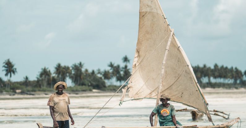 Locals - Men Riding a Boat