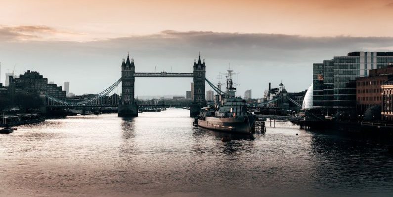 Landmarks - Black Boat Beside Bridge