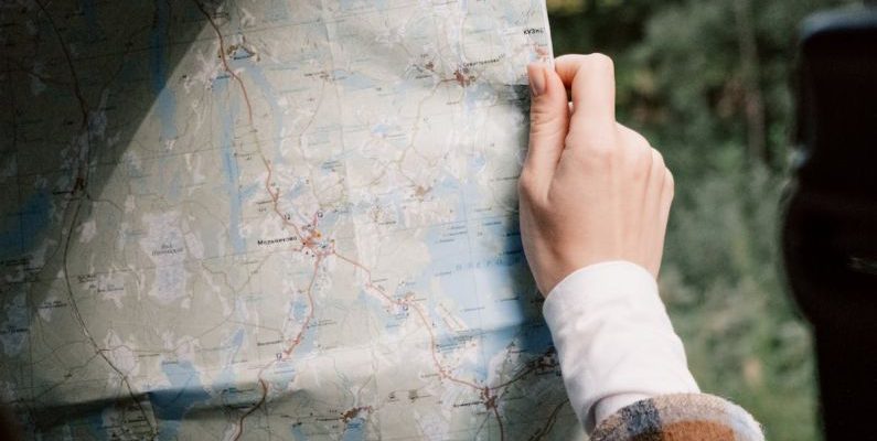 Itineraries - A Person Holding a Map