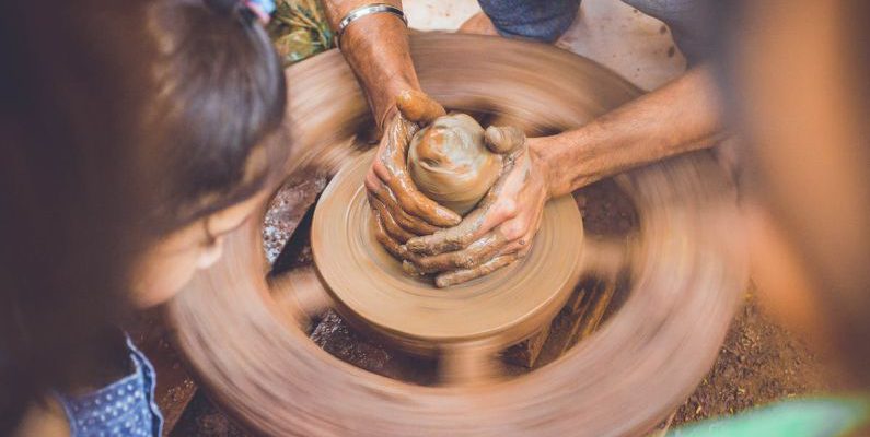 Experience - Person Making Clay Pot in Front of Girl during Daytime