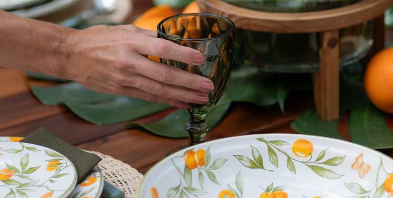 Czech Dishes - Woman Putting Drinking Glass on Table