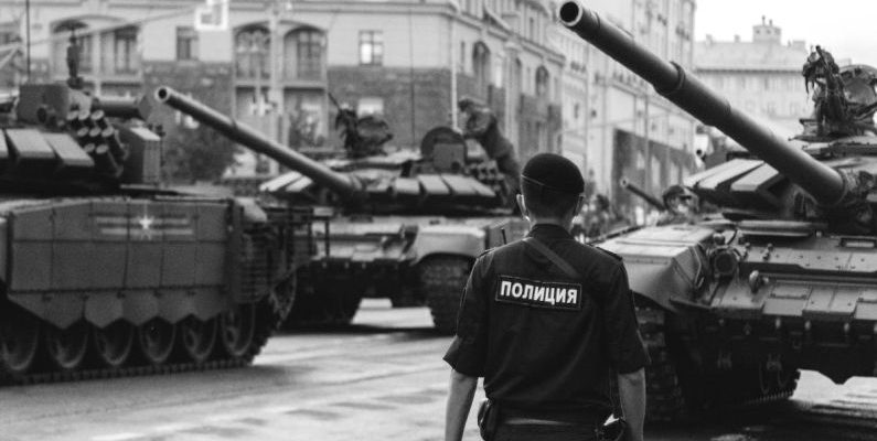 War - Policeman walking near Tanks